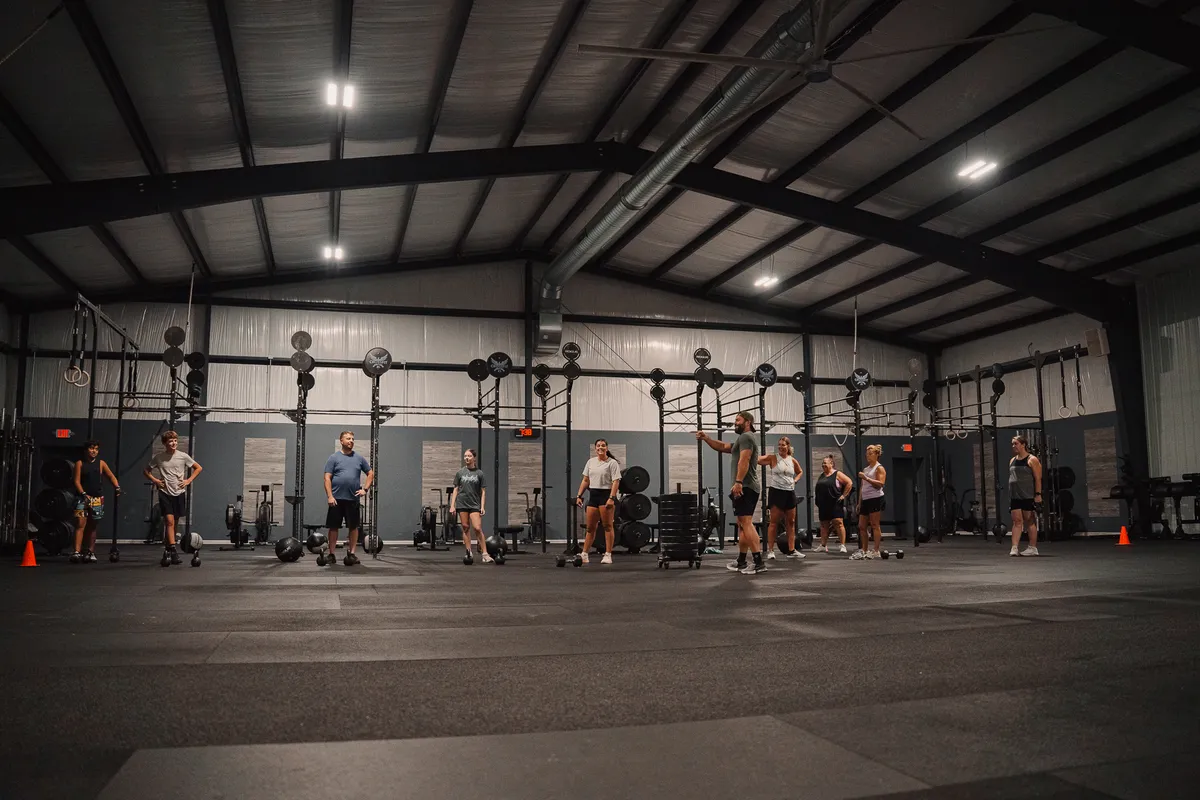Coach leading a group of members at CrossFit Fig in Grain Valley