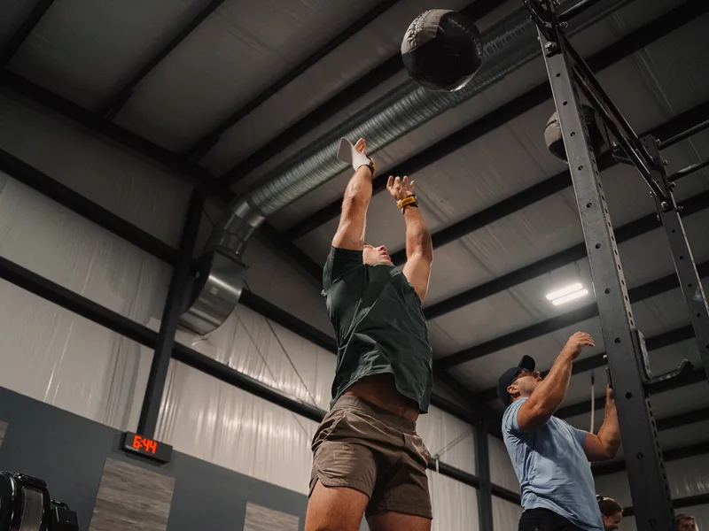 Members performing wall-ball exercises at CrossFit Fig in Grain Valley, Missouri.