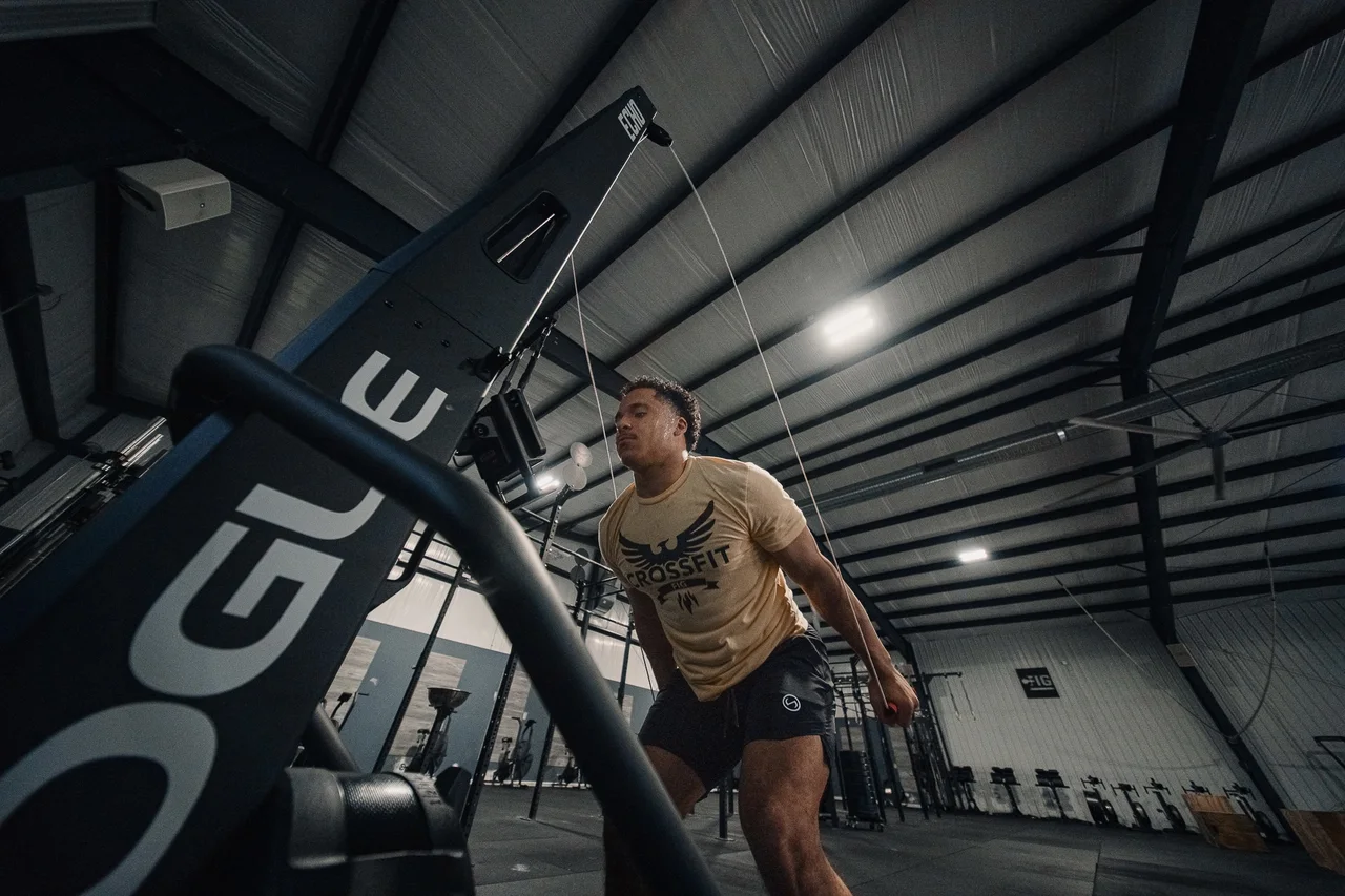 Athlete pulling the SkiErg handles during training at CrossFit Fig.